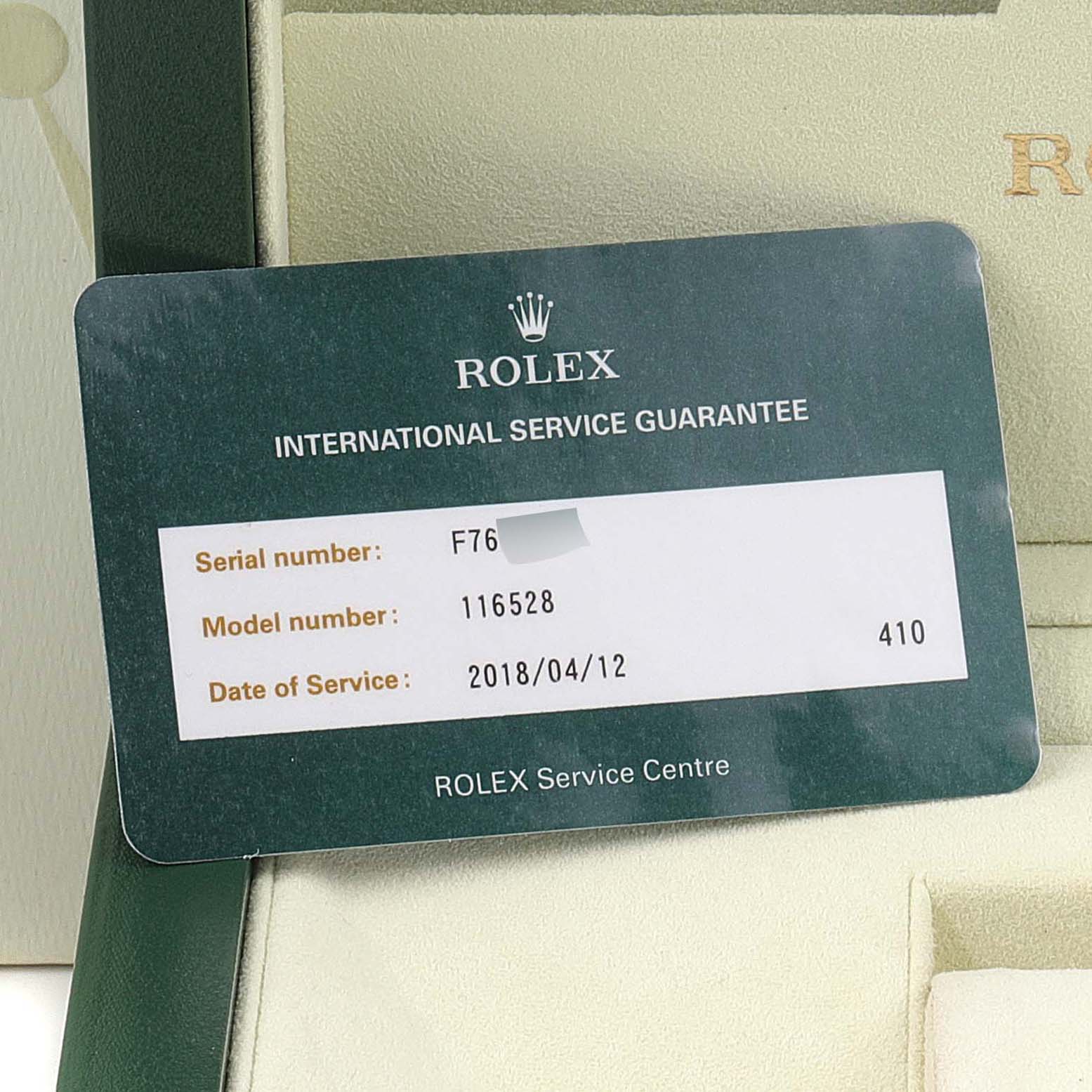 The image shows a Rolex International Service Guarantee card for a Daytona watch, model number 116528.