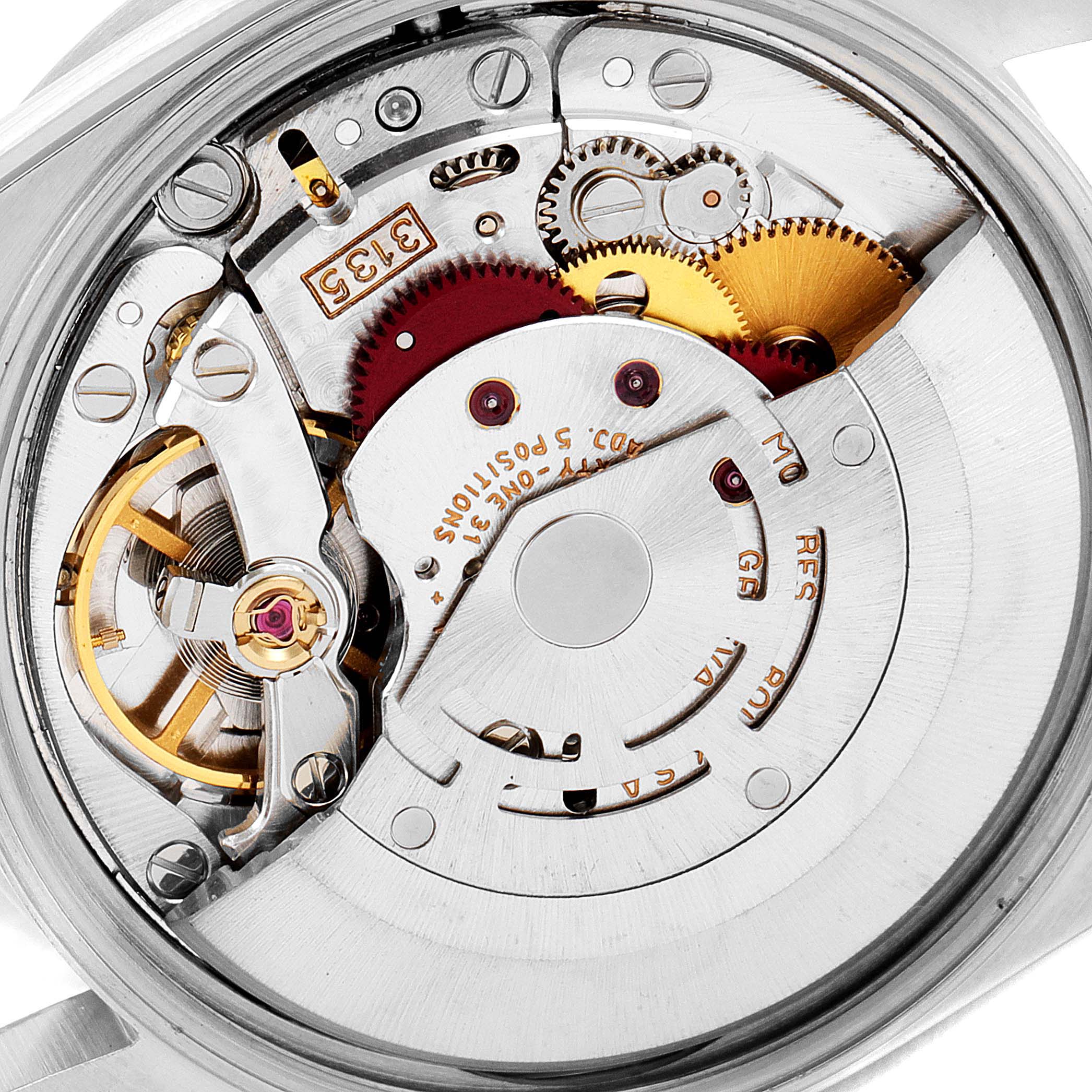The image shows an internal view of the Rolex Air-King 15210 Men's Stainless Steel Silver Dial 15210 Men's Stainless Steel Silver Dial, highlighting its complex mechanical movement components.