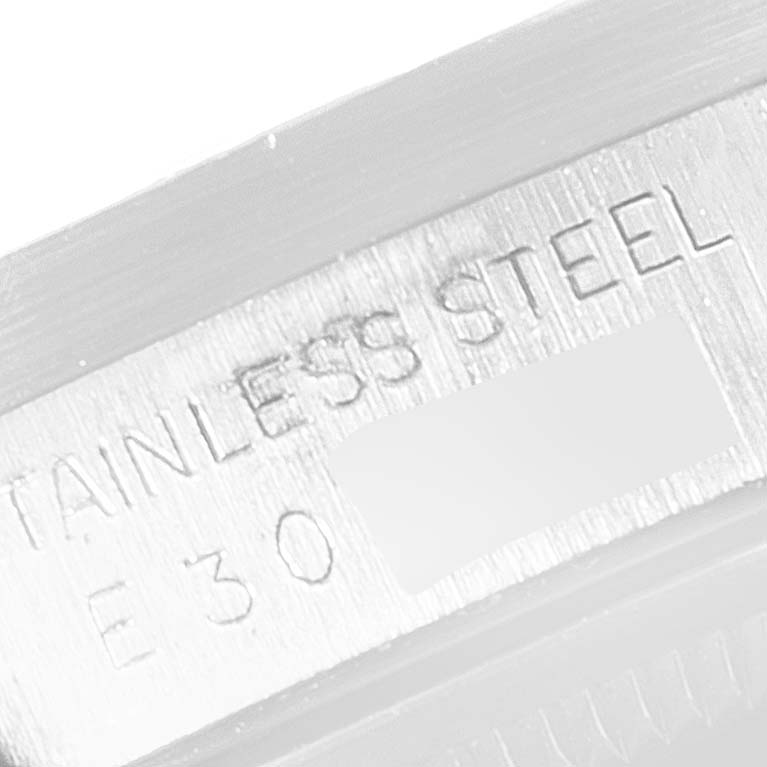 The image shows a close-up of the engraving on the stainless steel back of a Rolex Air-King 15210 Men's Stainless Steel Silver Dial 15210 Men's Stainless Steel Silver Dial watch.