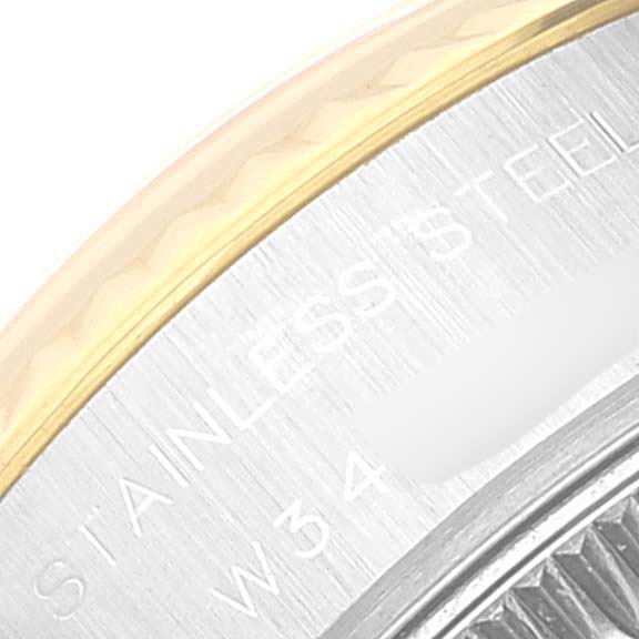 This close-up angle of the Rolex Datejust 69173 Women's Steel and Gold (two tone) Black Dial 69173 Women's Steel and Gold (two tone) Black Dial watch shows part of the case back and the inscription "STAINLESS STEEL."