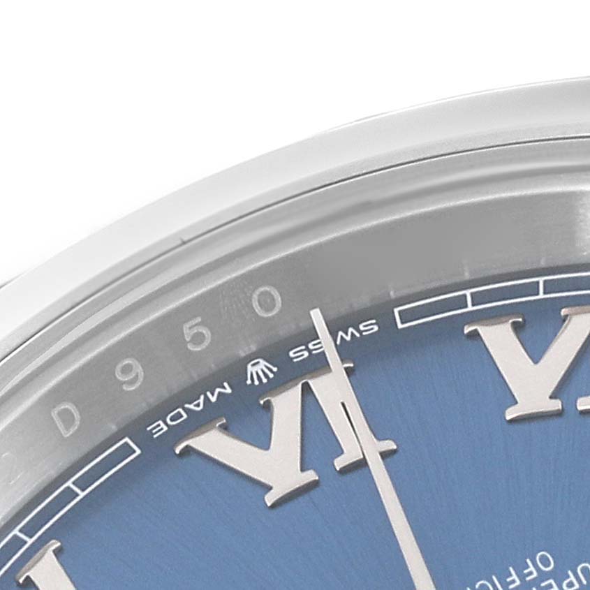 This close-up image shows the upper left corner of the dial of a Rolex Datejust 41 126300 Men's Stainless Steel Blue Dial 126300 Men's Stainless Steel Blue Dial, highlighting the Roman numerals and seconds markers.