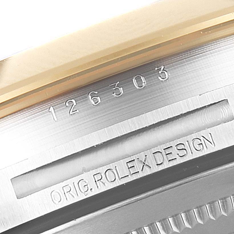 The image shows a close-up angle of the model number and "ORIG. ROLEX DESIGN" text on the side of the Rolex Datejust 41 126303 Men's Steel and Gold (two tone) Black Dial 126303 Men's Steel and Gold (two tone) Black Dial's case.
