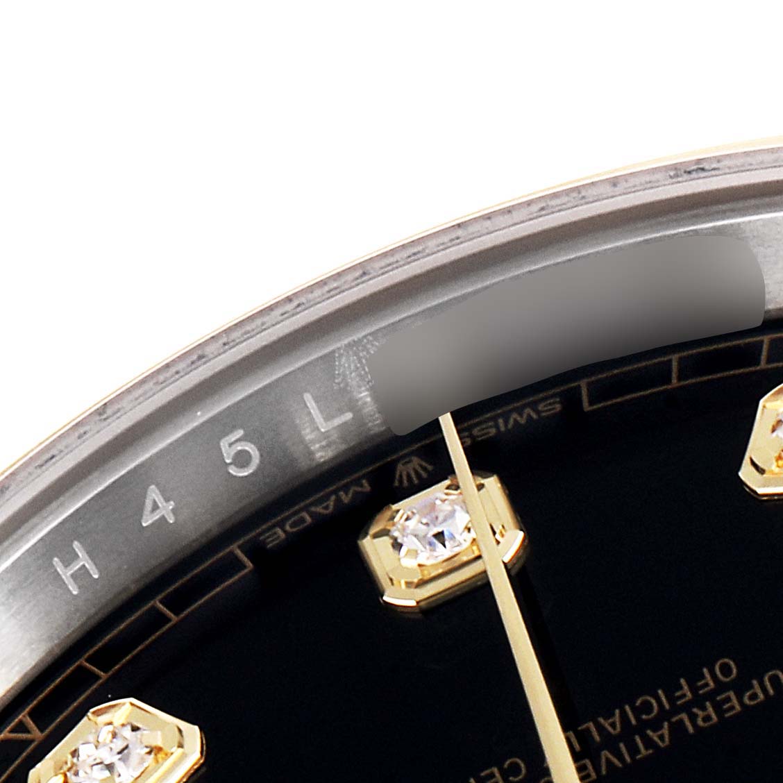 This close-up image shows part of the dial, diamond markers, and rehaut of the Rolex Datejust 41 126303 Men's Steel and Gold (two tone) Black Dial 126303 Men's Steel and Gold (two tone) Black Dial watch.