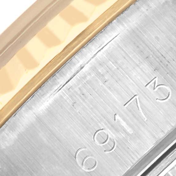 The image shows a close-up of the bezel and case side of a Rolex Datejust 69173 Women's Steel and Gold (two tone) Blue Dial 69173 Women's Steel and Gold (two tone) Blue Dial, highlighting the fluted bezel and engraved numbers.