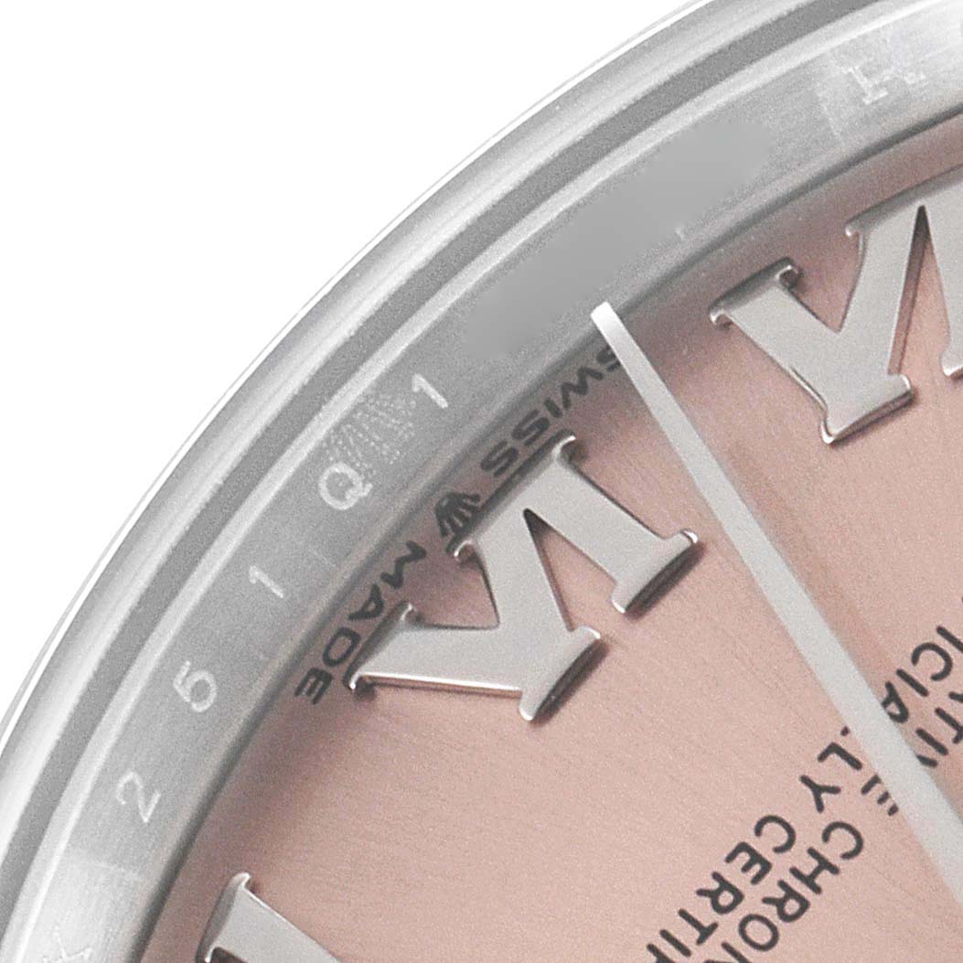 The image shows a close-up of the Rolex Mid-Size 278240 Women's Stainless Steel Pink Dial 278240 Women's Stainless Steel Pink Dial watch, highlighting the edge of the dial and part of the minute hand.
