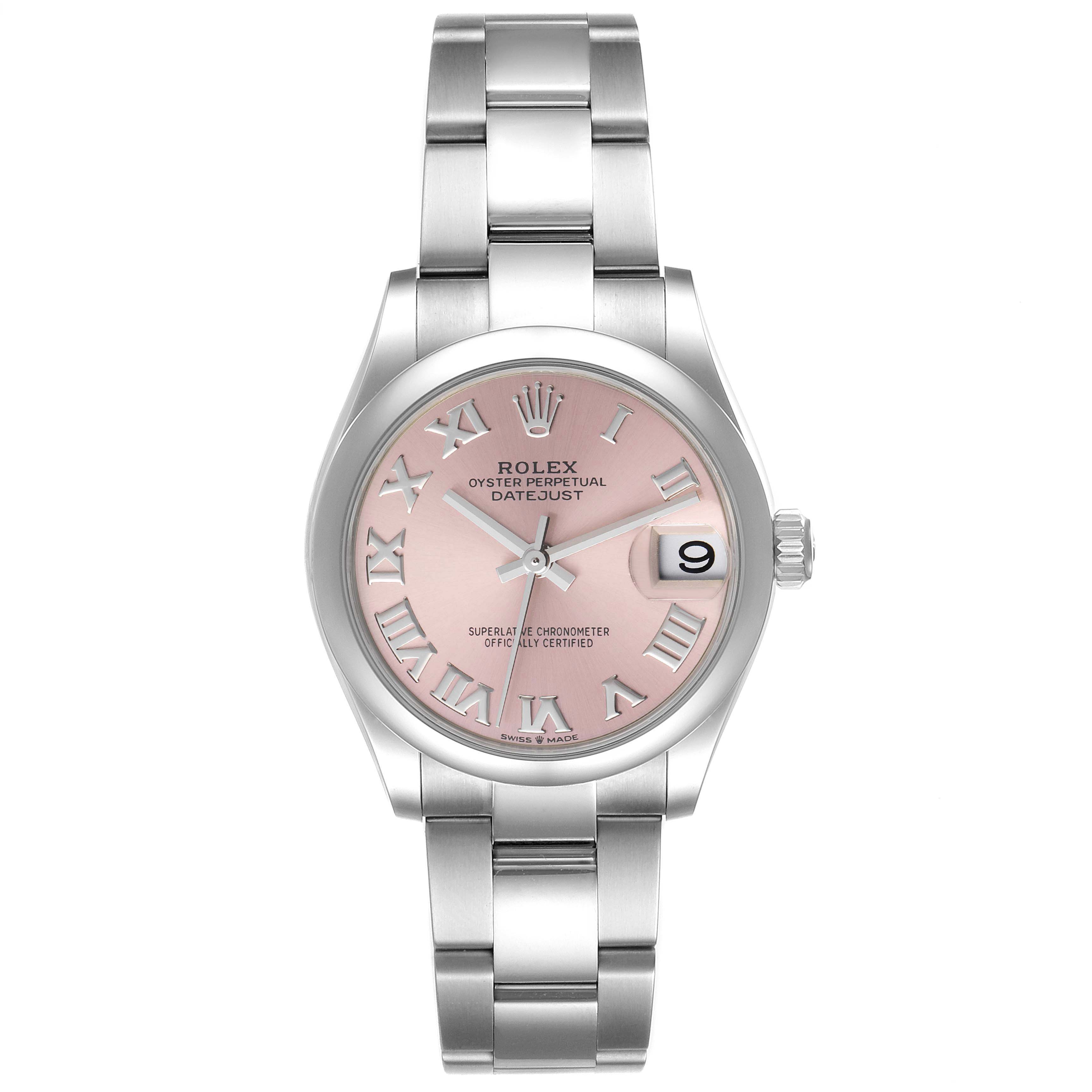 The image shows a front view of a Mid-Size Rolex Oyster Perpetual Datejust watch with a pink dial and stainless steel bracelet.