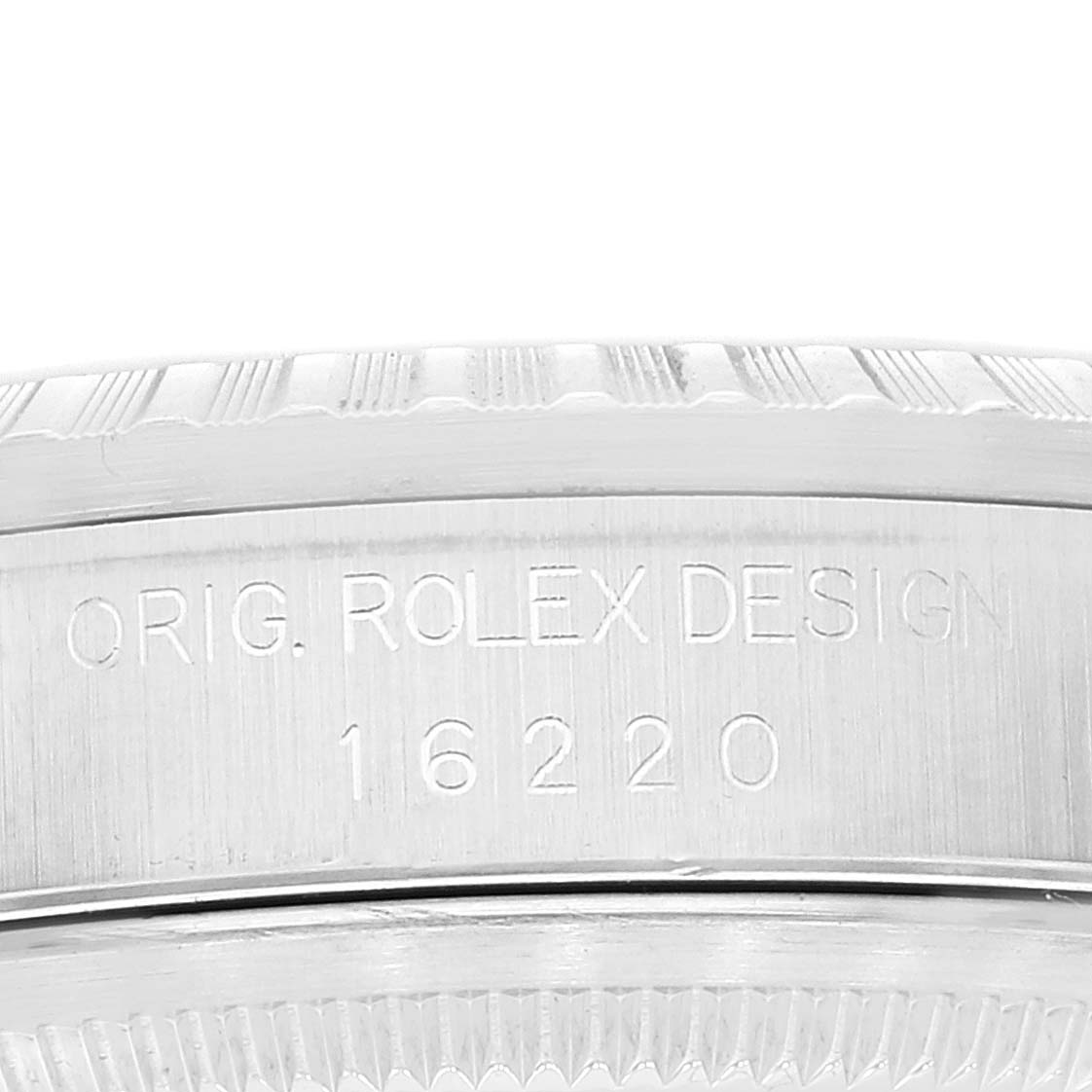 The image shows a close-up view of the bezel and case side of the Rolex Datejust 16220 Men's Stainless Steel Silver Dial 16220 Men's Stainless Steel Silver Dial watch, highlighting engraving details.
