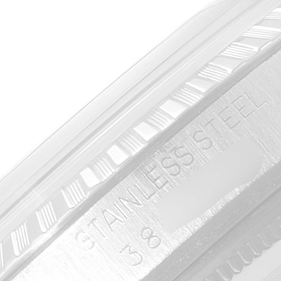 This image shows a close-up view of the bezel and case side of a Rolex Datejust 1603 Men
s Stainless Steel Silver Dial 1603 Men
s Stainless Steel Silver Dial, with "Stainless Steel" engraved.