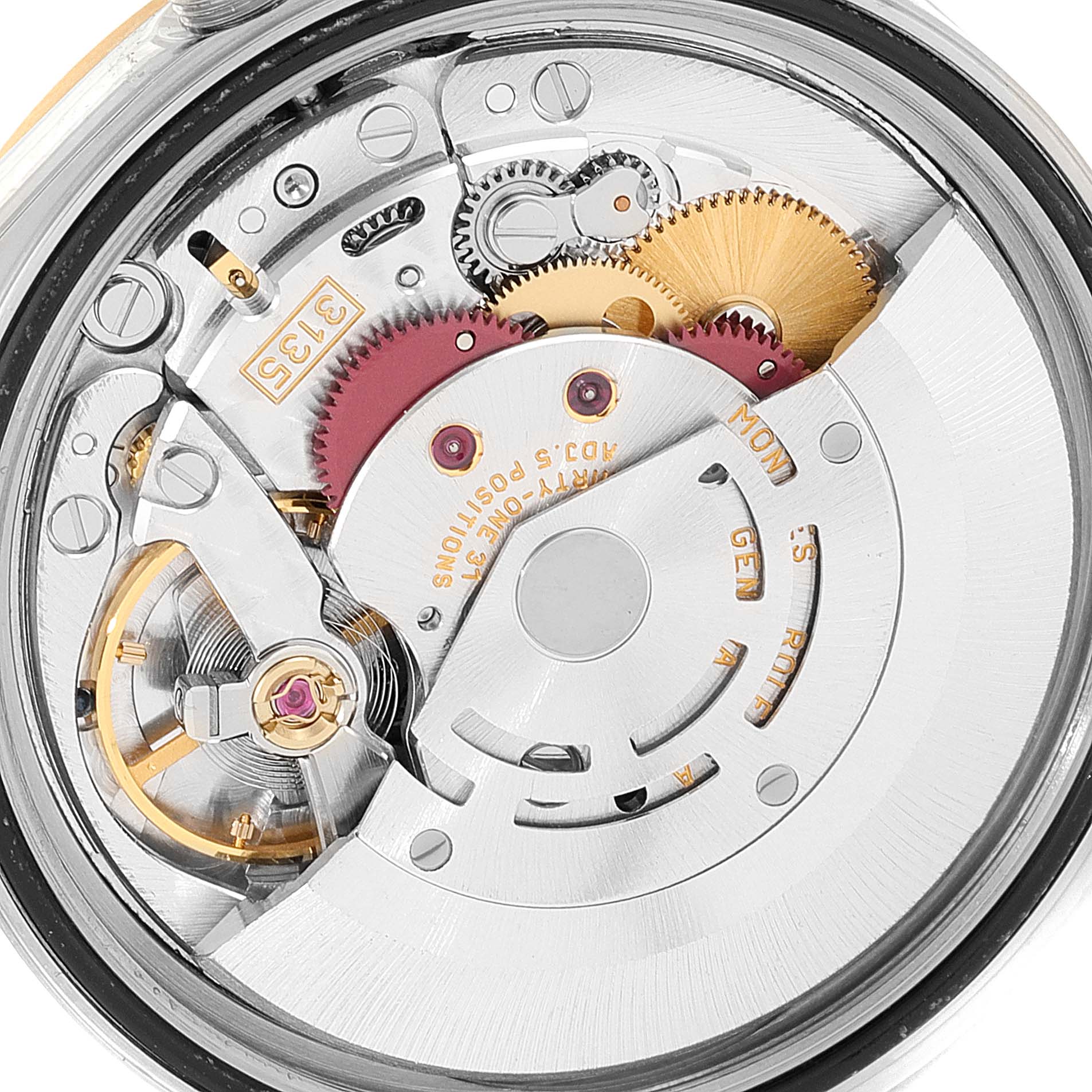 This image shows the intricate internal mechanism of a Rolex Datejust 16233 Men's Steel and Gold (two tone) Blue Dial 16233 Men's Steel and Gold (two tone) Blue Dial watch, focusing on its gear and spring components from a close-up angle.