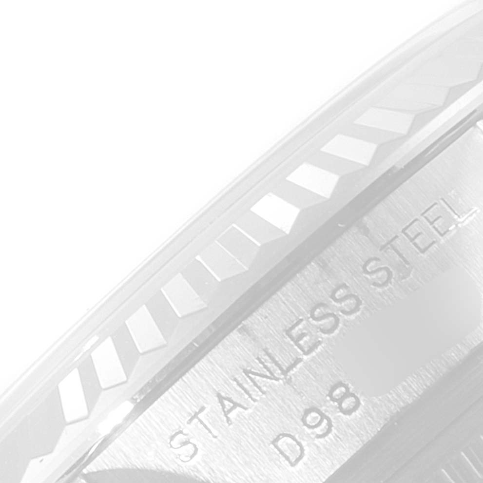 The image shows a close-up of the stainless steel case and fluted bezel of a Rolex Datejust 179174 Women's Stainless Steel Mother of Pearl Dial 179174 Women's Stainless Steel Mother of Pearl Dial watch.