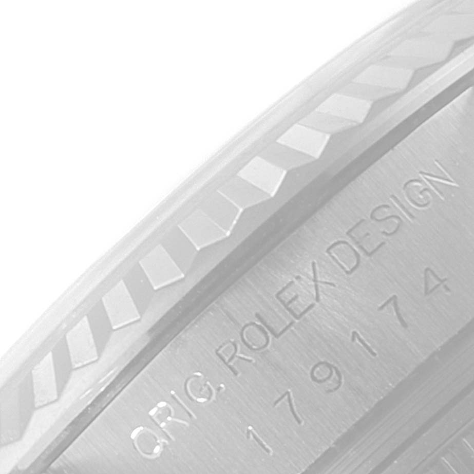 This image shows a close-up of the bezel and engraved serial number of the Rolex Datejust 179174 Women's Stainless Steel Mother of Pearl Dial 179174 Women's Stainless Steel Mother of Pearl Dial.