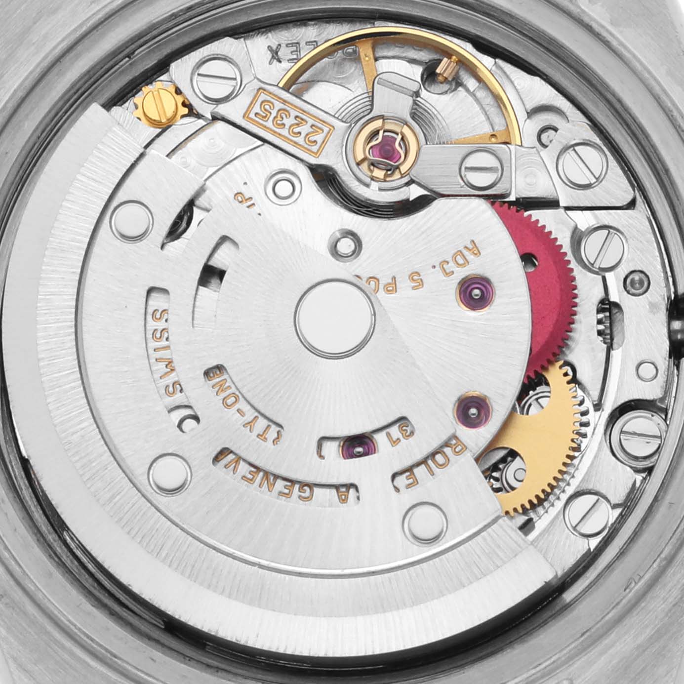 The image shows a close-up of the movement of a Rolex Datejust 79174 Women's Stainless Steel White Dial 79174 Women's Stainless Steel White Dial, highlighting the rotor, gears, and intricate components.