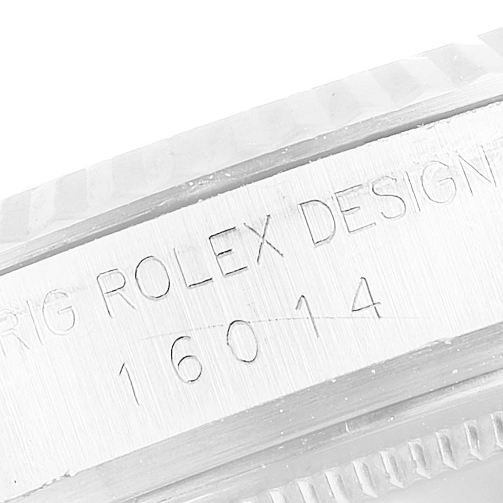 This partial top-down view shows the case side of the Vintage Collection Rolex model 16014, highlighting its engraved design.