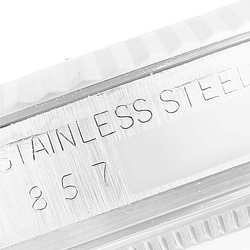 The image shows a close-up of the side engraving on a Rolex Vintage Collection 16014 Men's Stainless Steel Silver Dial 16014 Men's Stainless Steel Silver Dial model watch, highlighting "STAINLESS STEEL" and partial numbers.