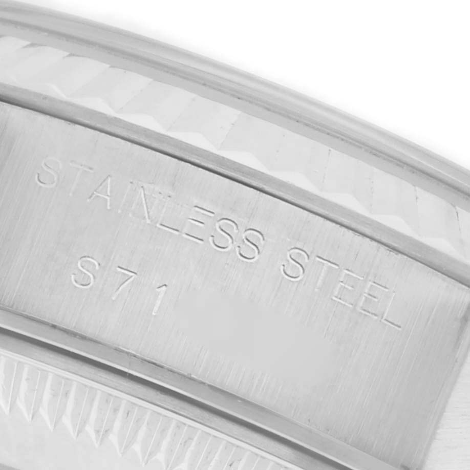 The image shows a close-up of the stainless steel case back of a Rolex Datejust 69174 Women's Stainless Steel Silver Dial 69174 Women's Stainless Steel Silver Dial watch, highlighting the engraved text.