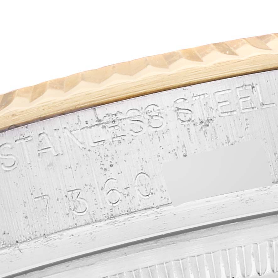 This close-up image shows the engraved stainless steel casing and part of the bezel of the Rolex Vintage Collection 16013 Men's Steel and Gold (two tone) Champagne Dial 16013 Men's Steel and Gold (two tone) Champagne Dial watch.