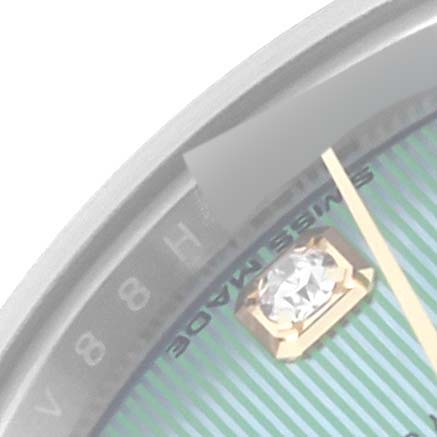 The image shows a close-up of the Rolex Datejust 279163 Women's Steel and Gold (two tone) Green Dial 279163 Women's Steel and Gold (two tone) Green Dial watch dial, highlighting the "SWISS MADE" text, a diamond hour marker, and part of the minute hand.