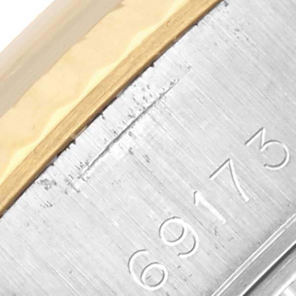 The image shows a close-up of the Rolex Datejust 69173 Women's Steel and Gold (two tone) Champagne Dial 69173 Women's Steel and Gold (two tone) Champagne Dial's edge and bezel, highlighting the case's brushed steel and gold detail.