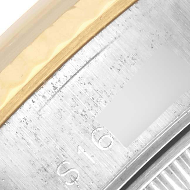 The image shows a close-up of the engraved inner bezel and the edge of the fluted bezel of a Rolex Datejust 69173 Women's Steel and Gold (two tone) Champagne Dial 69173 Women's Steel and Gold (two tone) Champagne Dial watch.