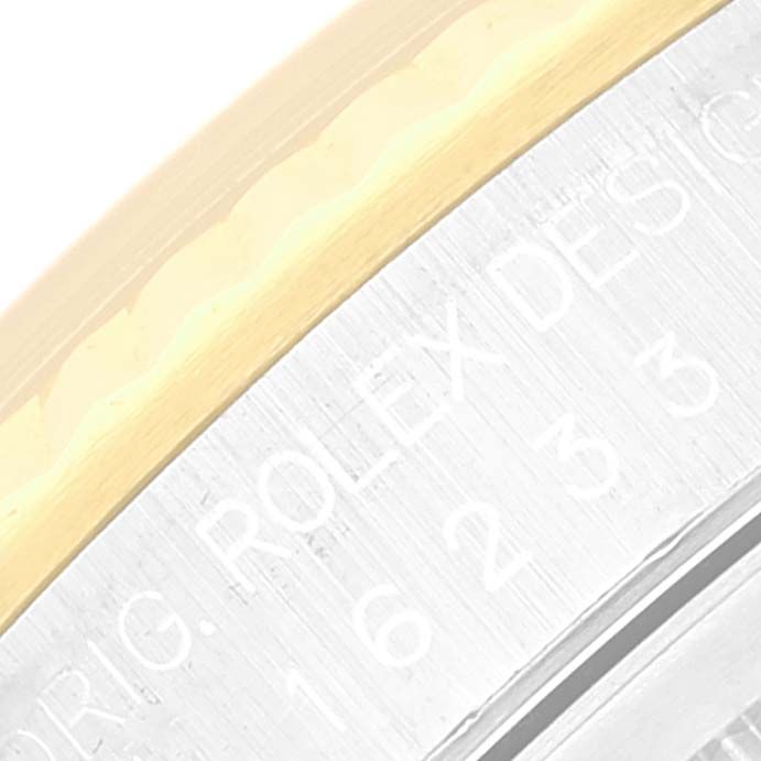 This image shows a close-up angle of the Rolex Datejust 16233 Men's Steel and Gold (two tone) Mother of Pearl Dial 16233 Men's Steel and Gold (two tone) Mother of Pearl Dial model's bezel and part of the case.