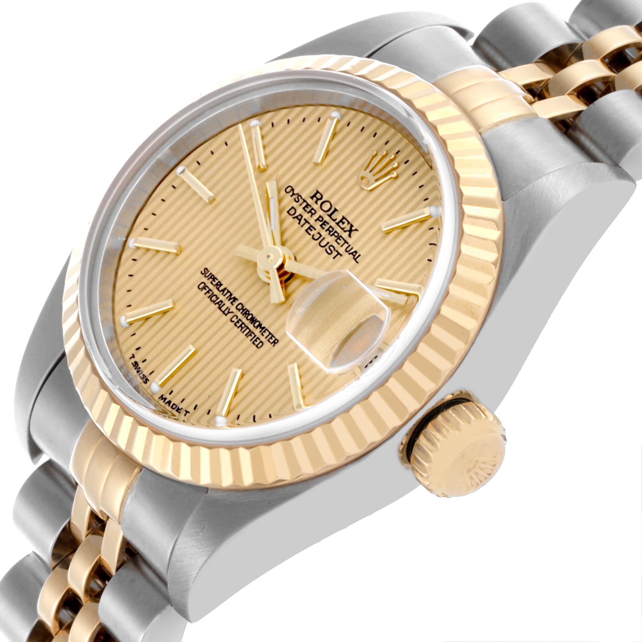 The Rolex Datejust 79173 Women's Steel and Gold (two tone) Champagne Dial 79173 Women's Steel and Gold (two tone) Champagne Dial watch is shown at an angled view, highlighting its face, bezel, crown, and part of the bracelet.
