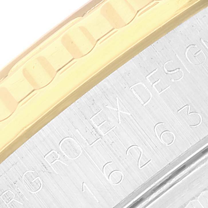 The close-up angle shows the bezel and part of the engraved casing of the Rolex Turn-o-Graph 16263 Men's Steel and Gold (two tone) Champagne Dial 16263 Men's Steel and Gold (two tone) Champagne Dial watch.