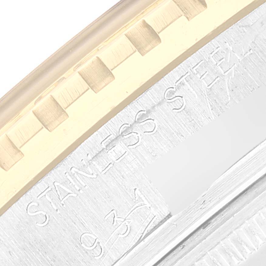 This close-up image shows the side view of the bezel and part of the engraved casing of a Rolex Vintage Collection 16253 Men's Steel and Gold (two tone) White Dial 16253 Men's Steel and Gold (two tone) White Dial watch.