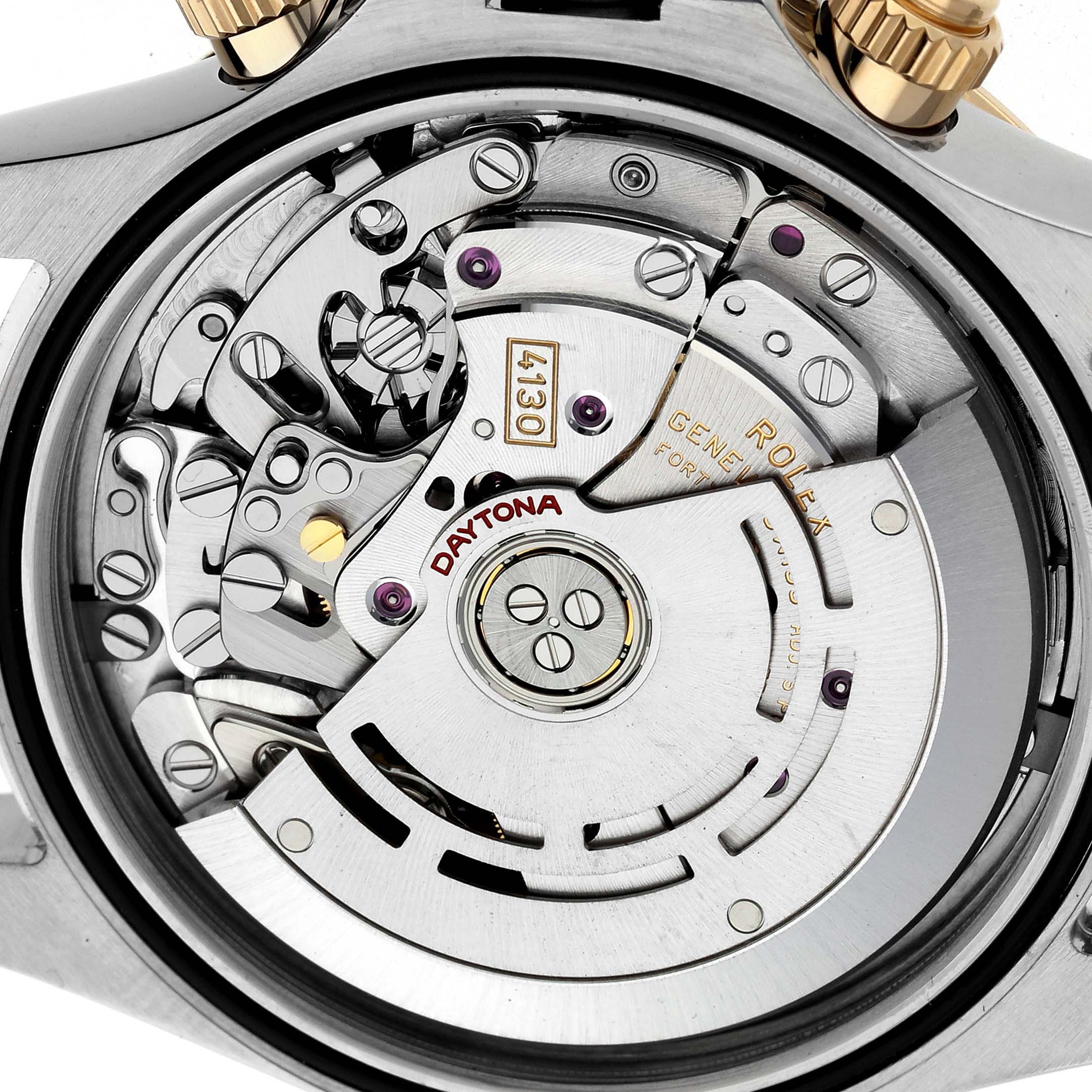 The image shows the movement of a Rolex Daytona 116523 Men's Steel and Gold (two tone) Silver Dial 116523 Men's Steel and Gold (two tone) Silver Dial watch from the back, highlighting internal mechanisms and the rotor.