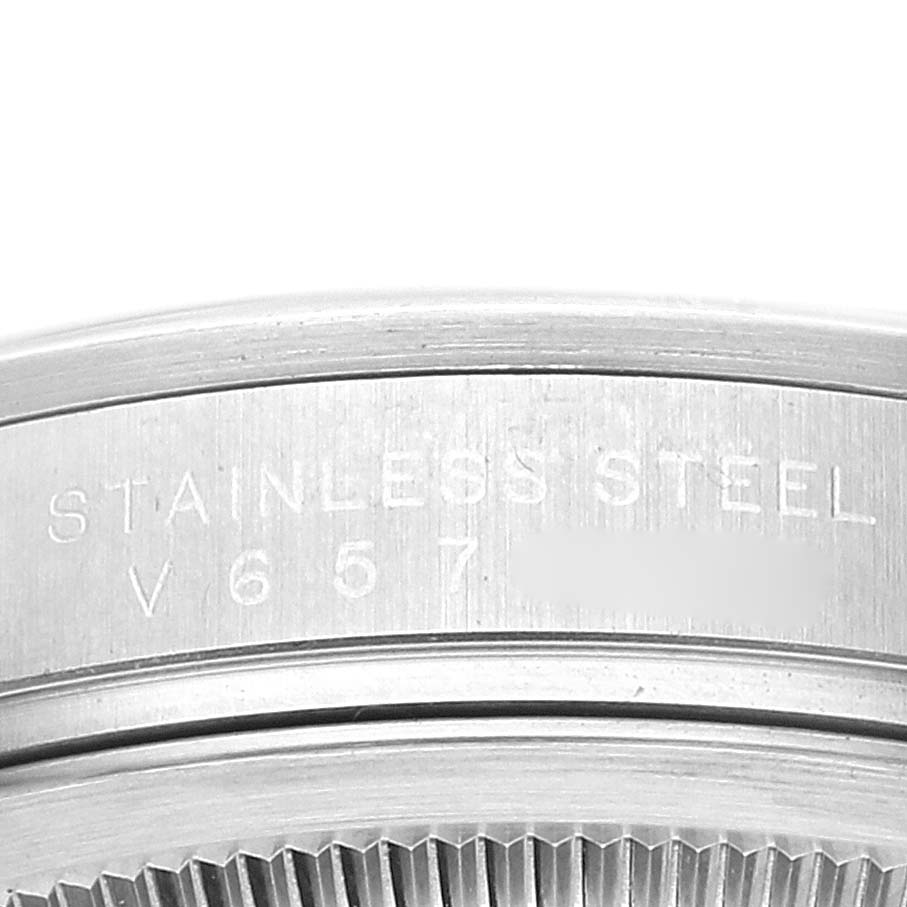 The image shows a close-up view of the case back of a Rolex Explorer 114270 Men
s Stainless Steel Black Dial 114270 Men
s Stainless Steel Black Dial watch, highlighting the stainless steel material and model number.
