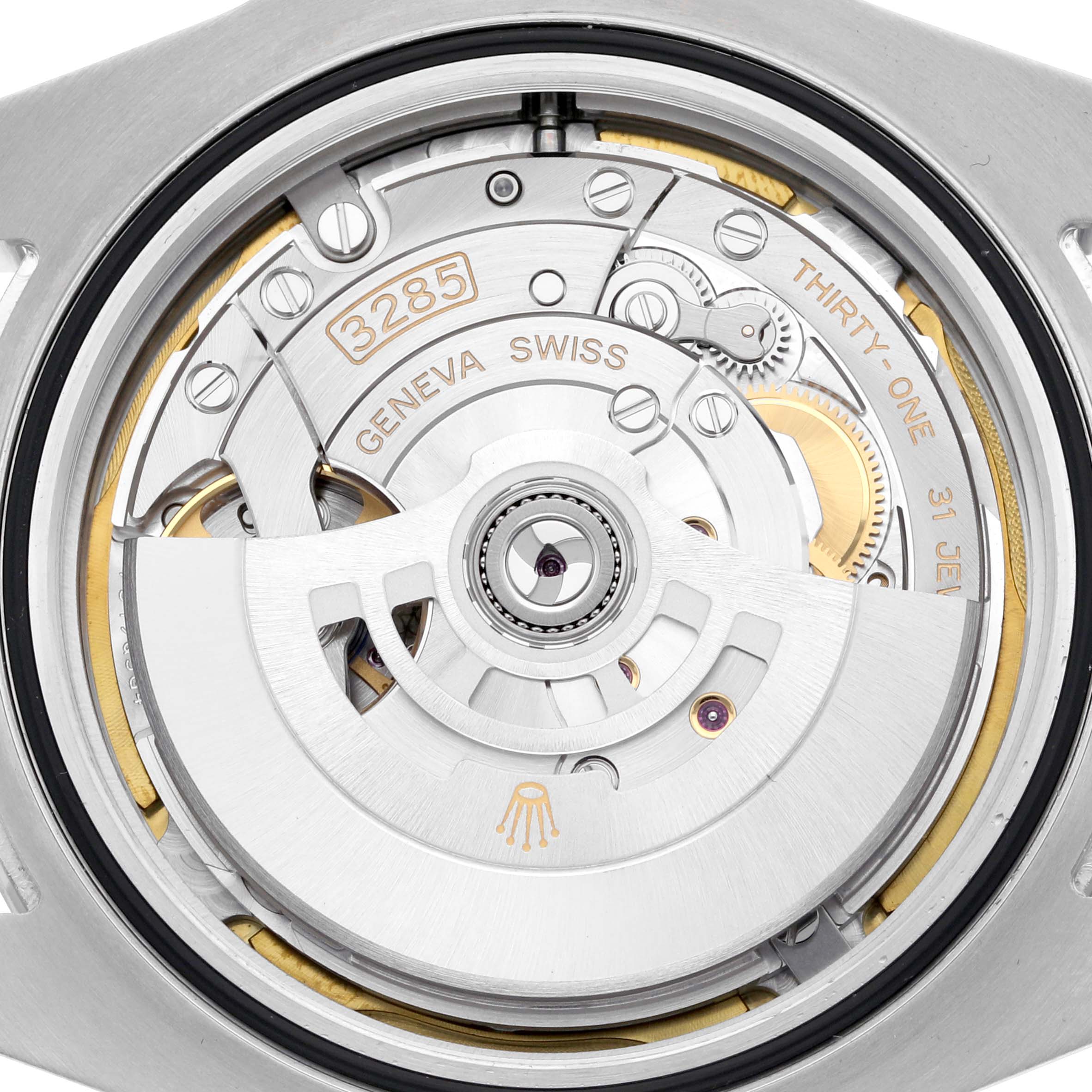 The image shows the movement of a Rolex Explorer M226570-0002 Men's Stainless Steel Black Dial M226570-0002 Men's Stainless Steel Black Dial watch from a top-down angle highlighting the mechanism and rotor.