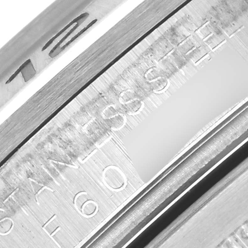 The image shows a close-up of the inner bezel with engravings on a Rolex Explorer 16570 Men's Stainless Steel White Dial 16570 Men's Stainless Steel White Dial watch.