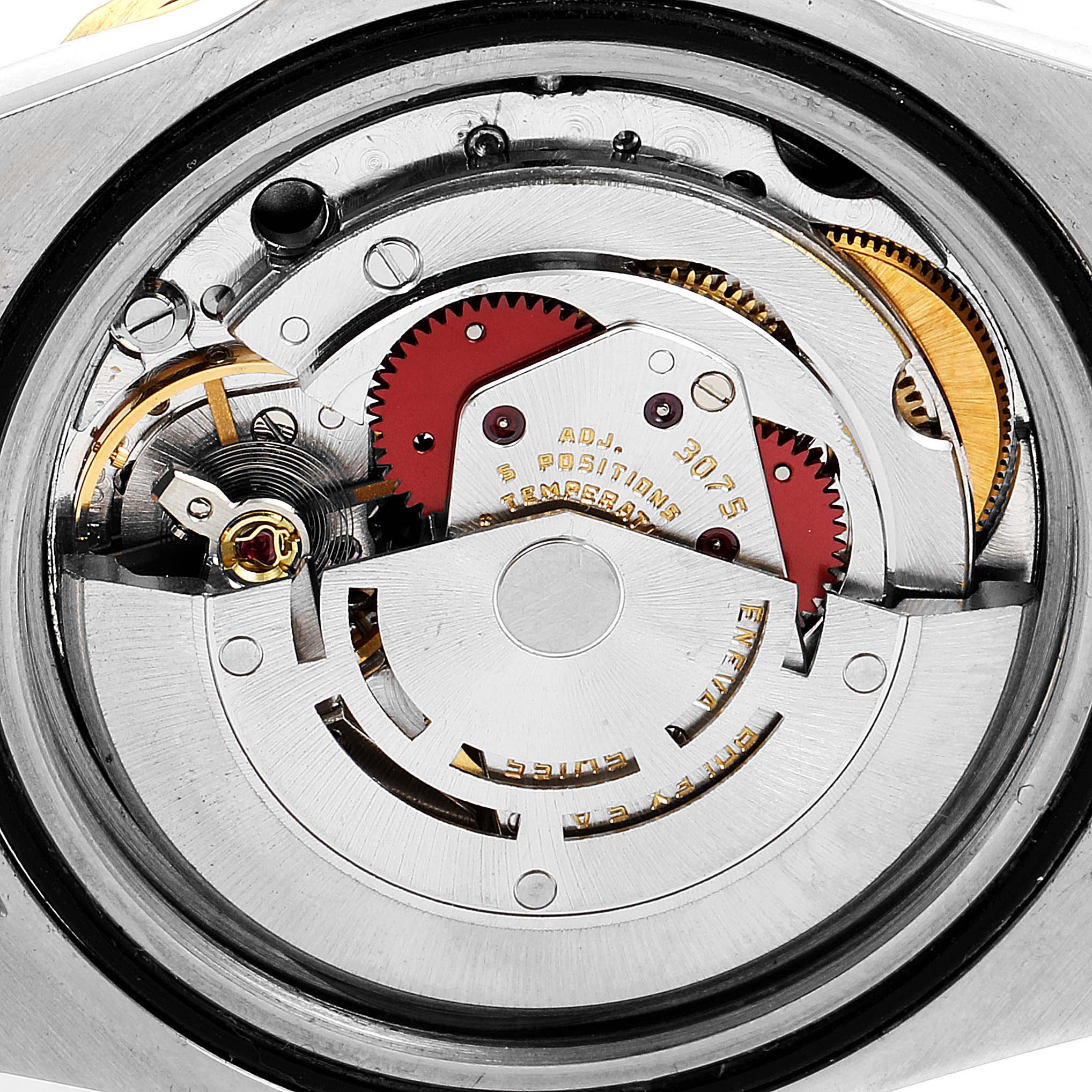 The image shows the internal mechanical movement of a Vintage Collection Rolex watch.