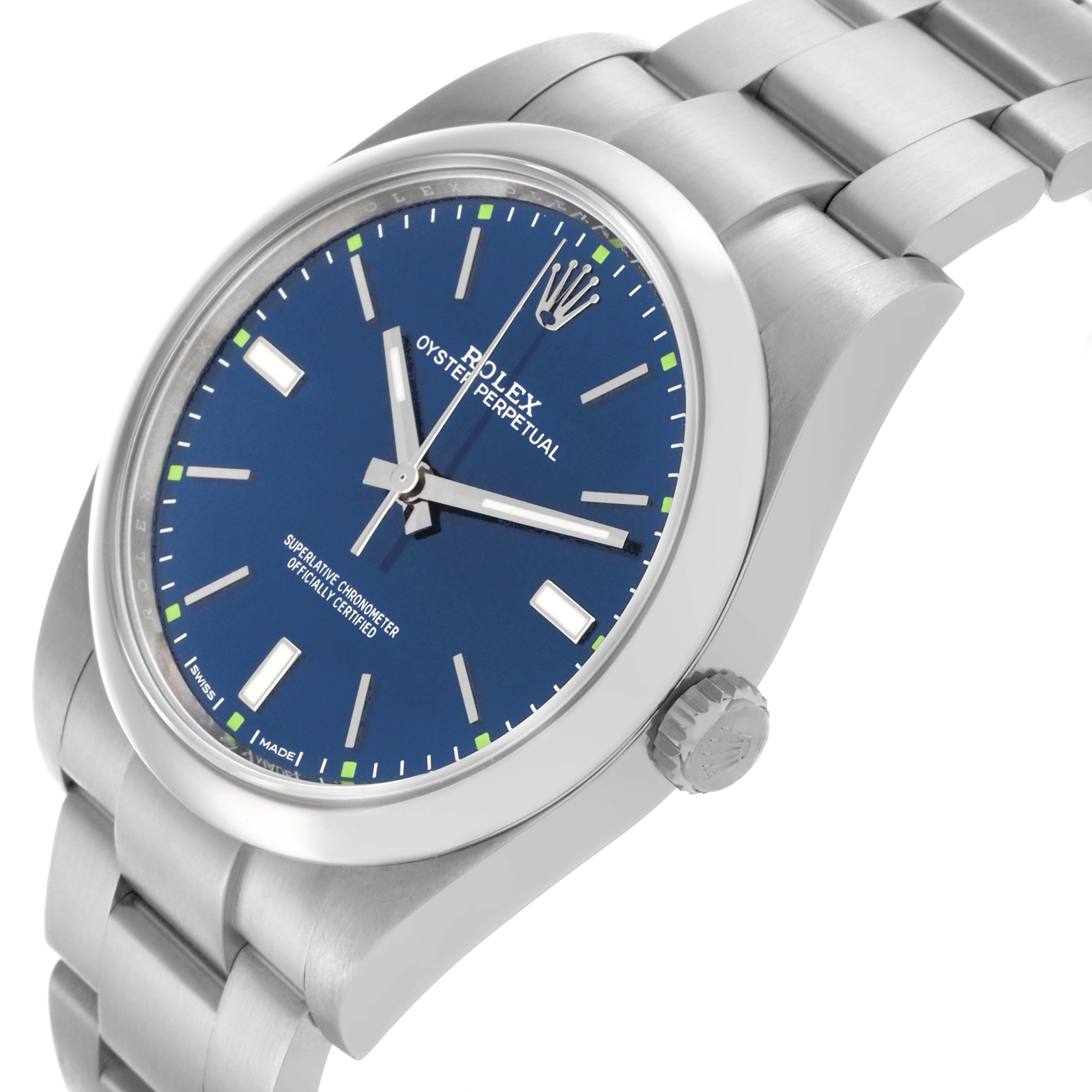 The Rolex Oyster Perpetual 114300 Men's Stainless Steel Blue Dial 114300 Men's Stainless Steel Blue Dial watch is shown at a slight angle, highlighting the blue dial, crown, and part of the bracelet.