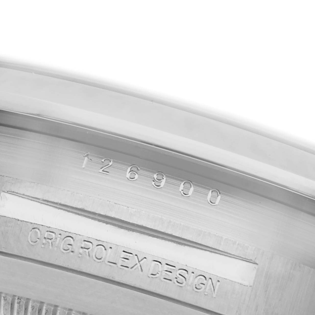 The image shows a close-up of the case edge with engraved text on the Rolex Air-King 126900 Men's Stainless Steel Black Dial 126900 Men's Stainless Steel Black Dial watch.
