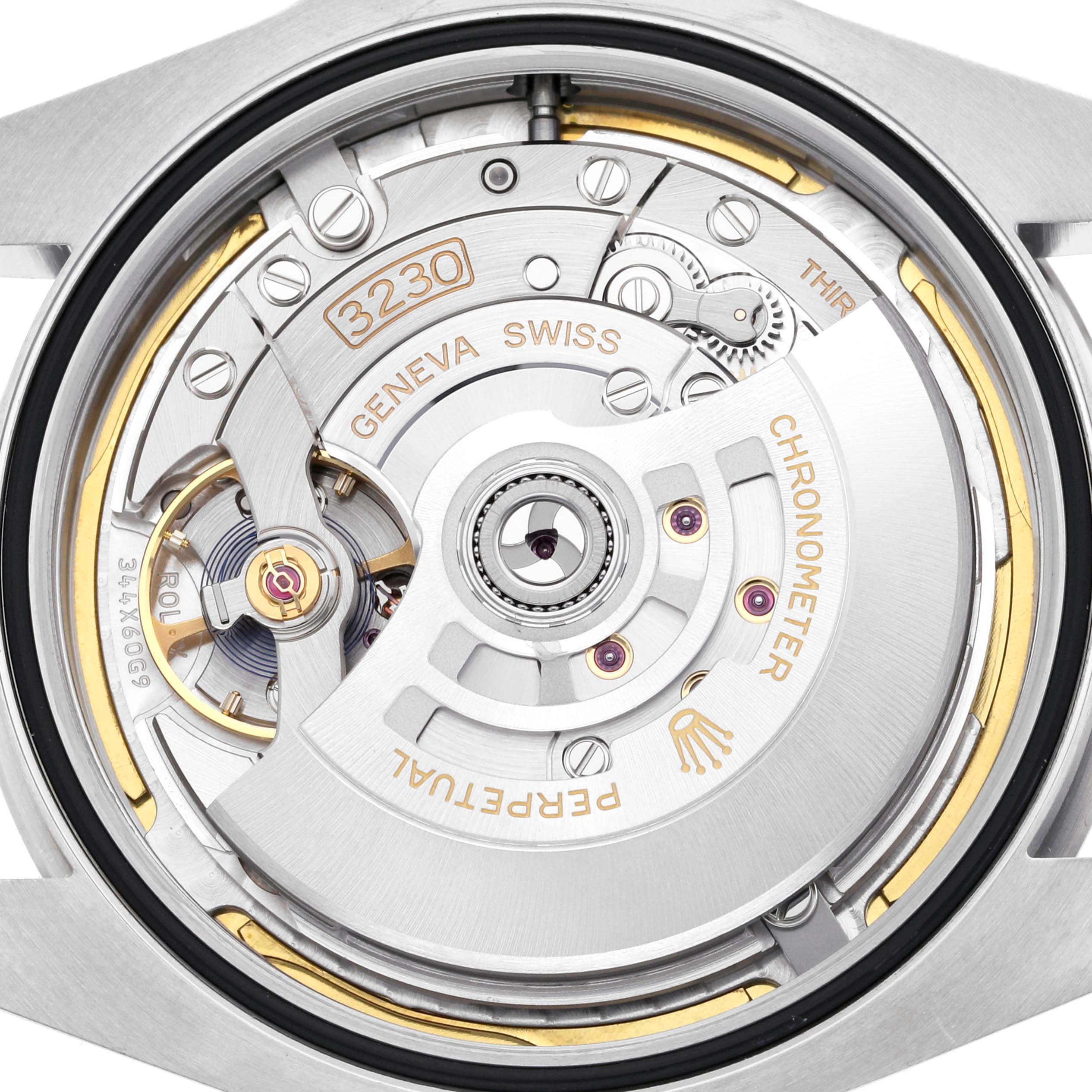 This image shows the movement of a Rolex Air-King 126900 Men's Stainless Steel Black Dial 126900 Men's Stainless Steel Black Dial watch from the back, highlighting the intricate internal mechanisms.