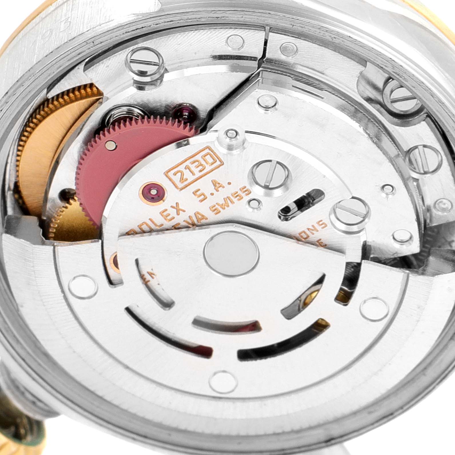 This image shows a close-up view of the internal mechanism of a Rolex Oyster Perpetual 67193 Women
s Steel and Gold (two tone) Champagne Dial 67193 Women
s Steel and Gold (two tone) Champagne Dial watch, highlighting the movement parts.
