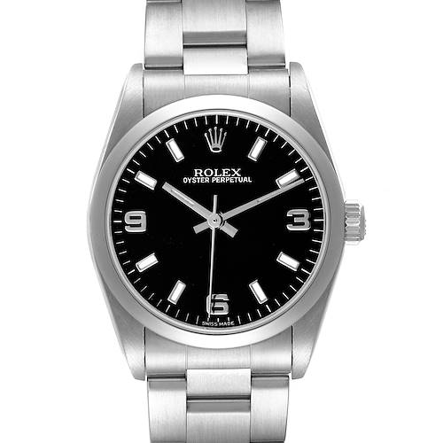 The Rolex Oyster Perpetual 77080 Women's Stainless Steel Black Dial watch is shown from a top-down angle, displaying the face, case, and part of the bracelet.