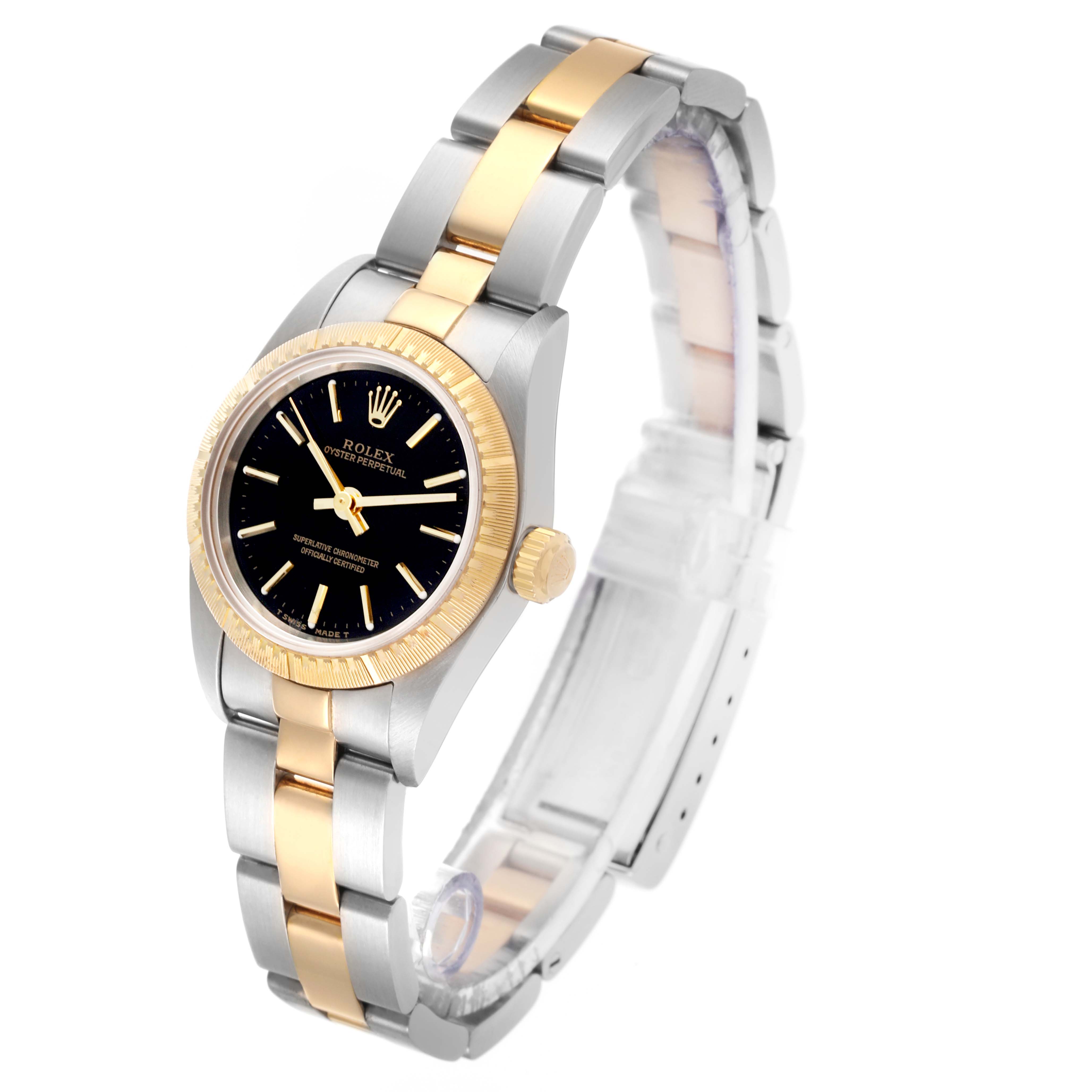 The Rolex Oyster Perpetual 76243 Women's Steel and Gold (two tone) Black Dial 76243 Women's Steel and Gold (two tone) Black Dial watch is shown at a three-quarter angle, highlighting the two-tone bracelet and fluted bezel.