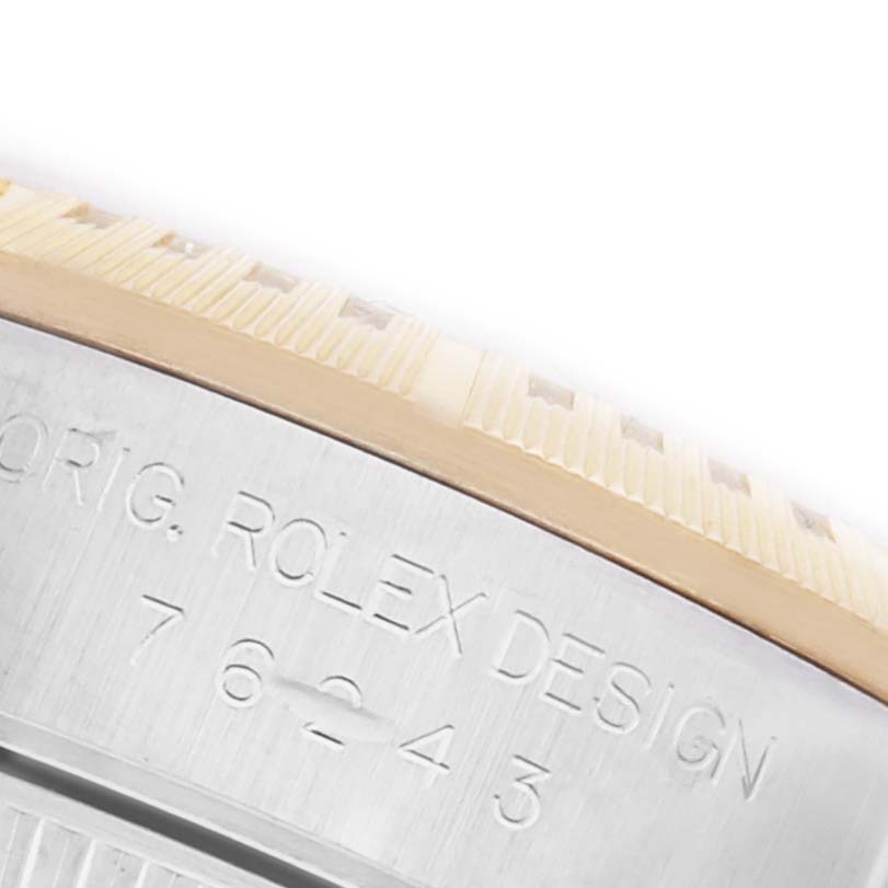 The image shows the engraved side of the case of a Rolex Oyster Perpetual 76243 Women's Steel and Gold (two tone) Black Dial 76243 Women's Steel and Gold (two tone) Black Dial watch, highlighting the model number and branding.