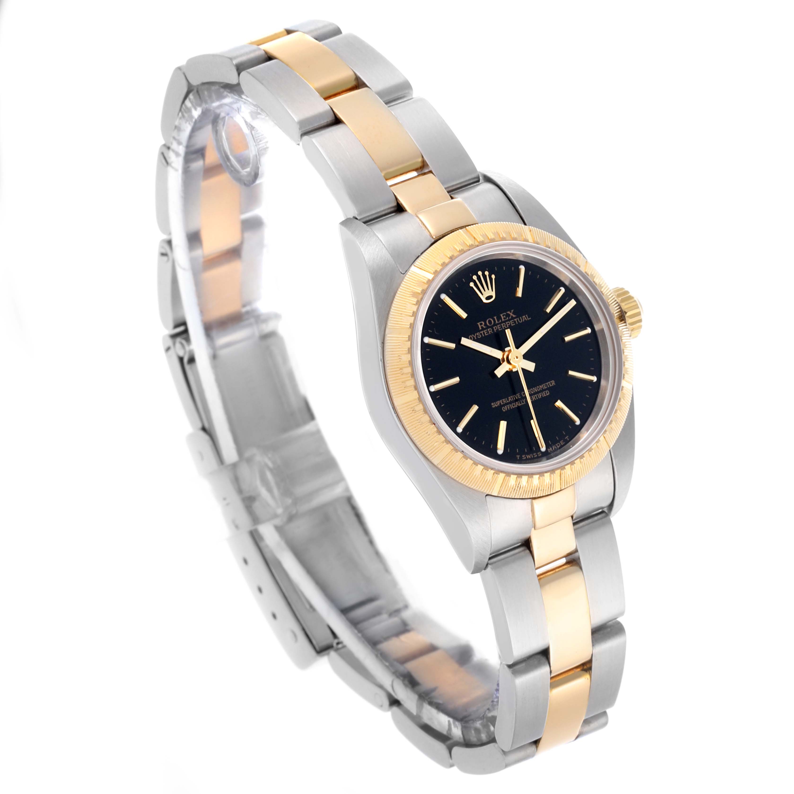 The Rolex Oyster Perpetual 76243 Women's Steel and Gold (two tone) Black Dial 76243 Women's Steel and Gold (two tone) Black Dial watch is shown at an angle displaying the face, bezel, crown, and part of the bracelet.
