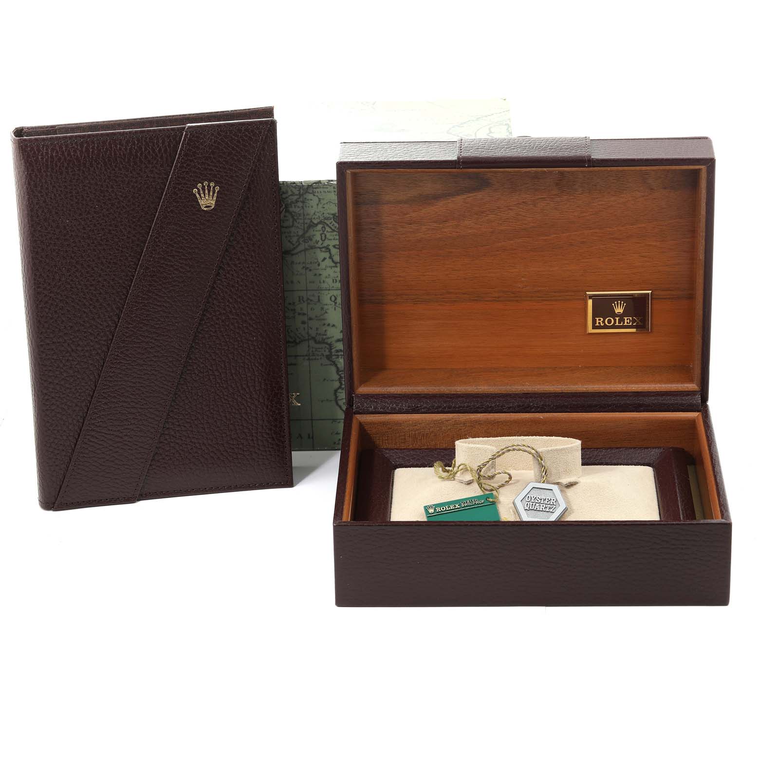 The image shows an empty Rolex wooden watch box and a leather booklet holder for the President model.