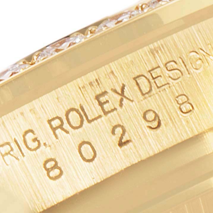 This is a close-up view of the side of a Rolex Pearlmaster 80298 Women's Yellow Gold Mother of Pearl Dial 80298 Women's Yellow Gold Mother of Pearl Dial watch, showing part of the bezel and engraved model details.