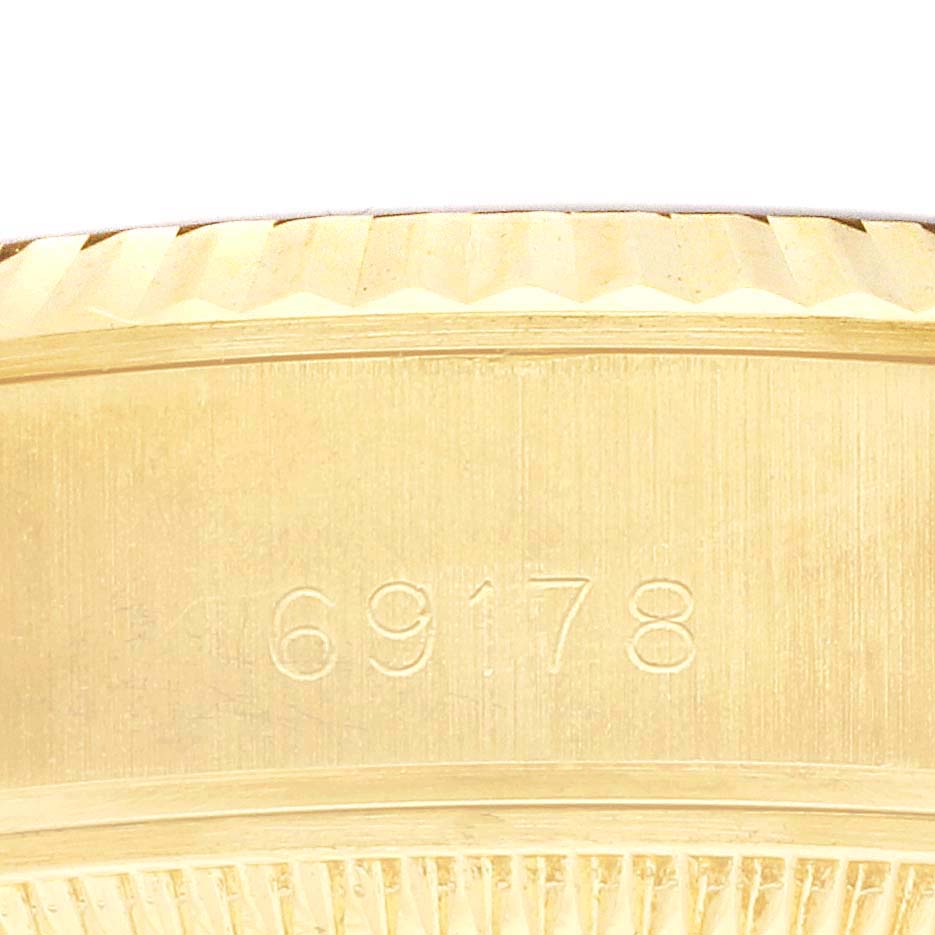 The image shows a close-up of the side of a Rolex President 69178 Women's Yellow Gold Champagne Dial 69178 Women's Yellow Gold Champagne Dial model, highlighting the model number engraving.