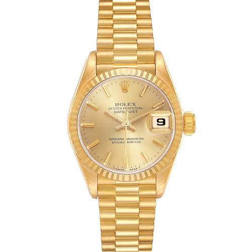 The Rolex President watch is shown from a top-down angle, highlighting the gold dial, fluted bezel, and President bracelet.