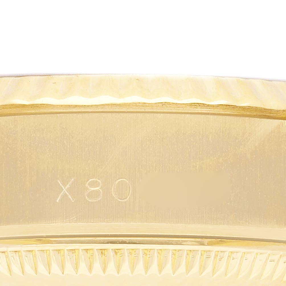 The image shows a side view of the Rolex President 69178 Women's Yellow Gold Champagne Dial 69178 Women's Yellow Gold Champagne Dial model, focusing on its gold fluted bezel and case edge.