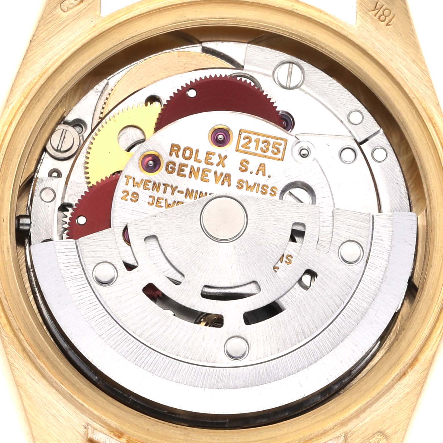 The image shows the movement of a Rolex President 69178 Women's Yellow Gold Champagne Dial 69178 Women's Yellow Gold Champagne Dial watch from the back, showcasing gears and inscriptions.