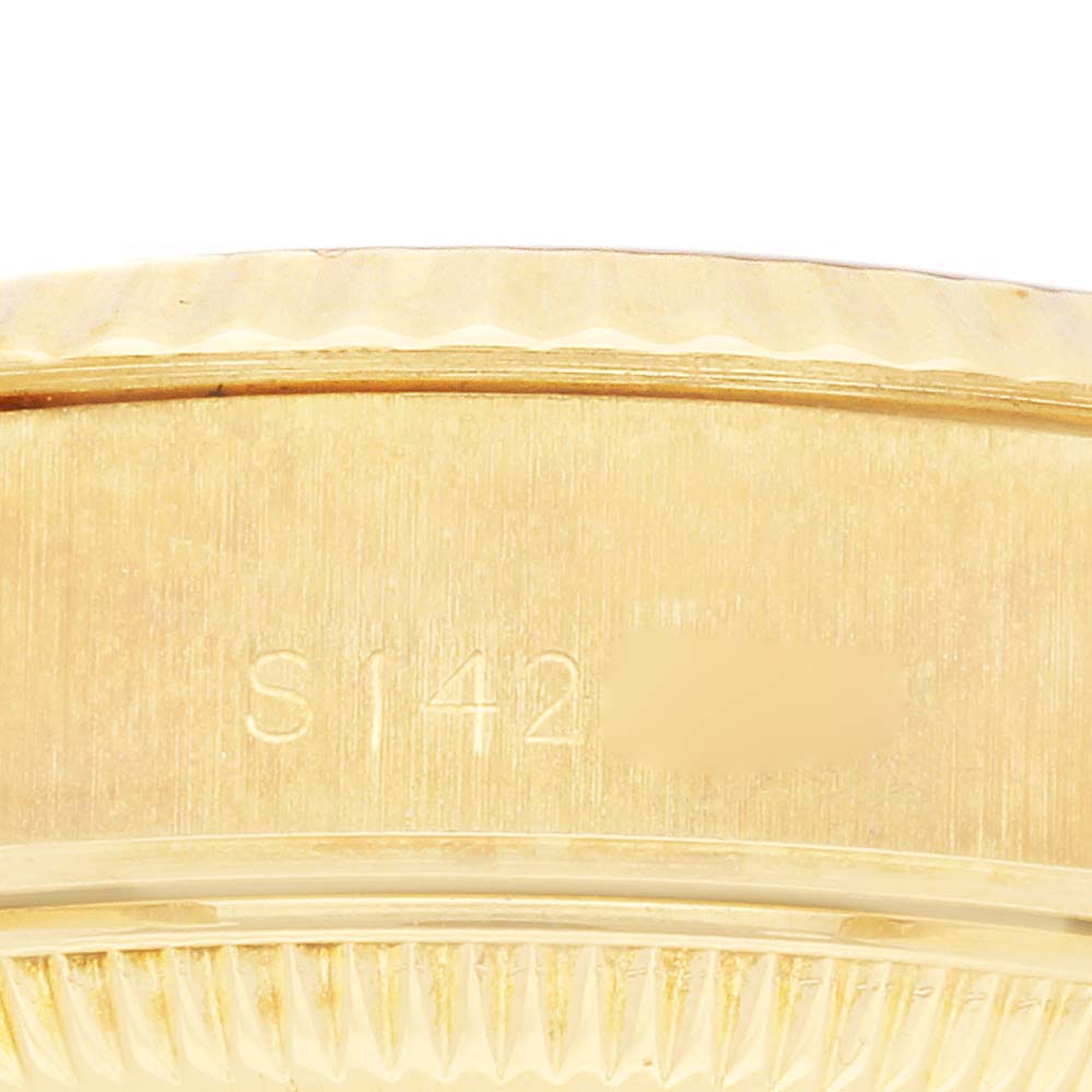 The image shows a close-up of the side of a Rolex President 69178 Women's Yellow Gold Champagne Dial 69178 Women's Yellow Gold Champagne Dial watch, highlighting the serial number engraving.