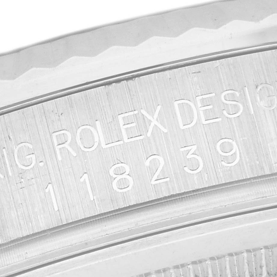 The image shows an engraved side of a Rolex President 118239 Men
s White Gold White Dial 118239 Men
s White Gold White Dial model, focusing on the reference number.