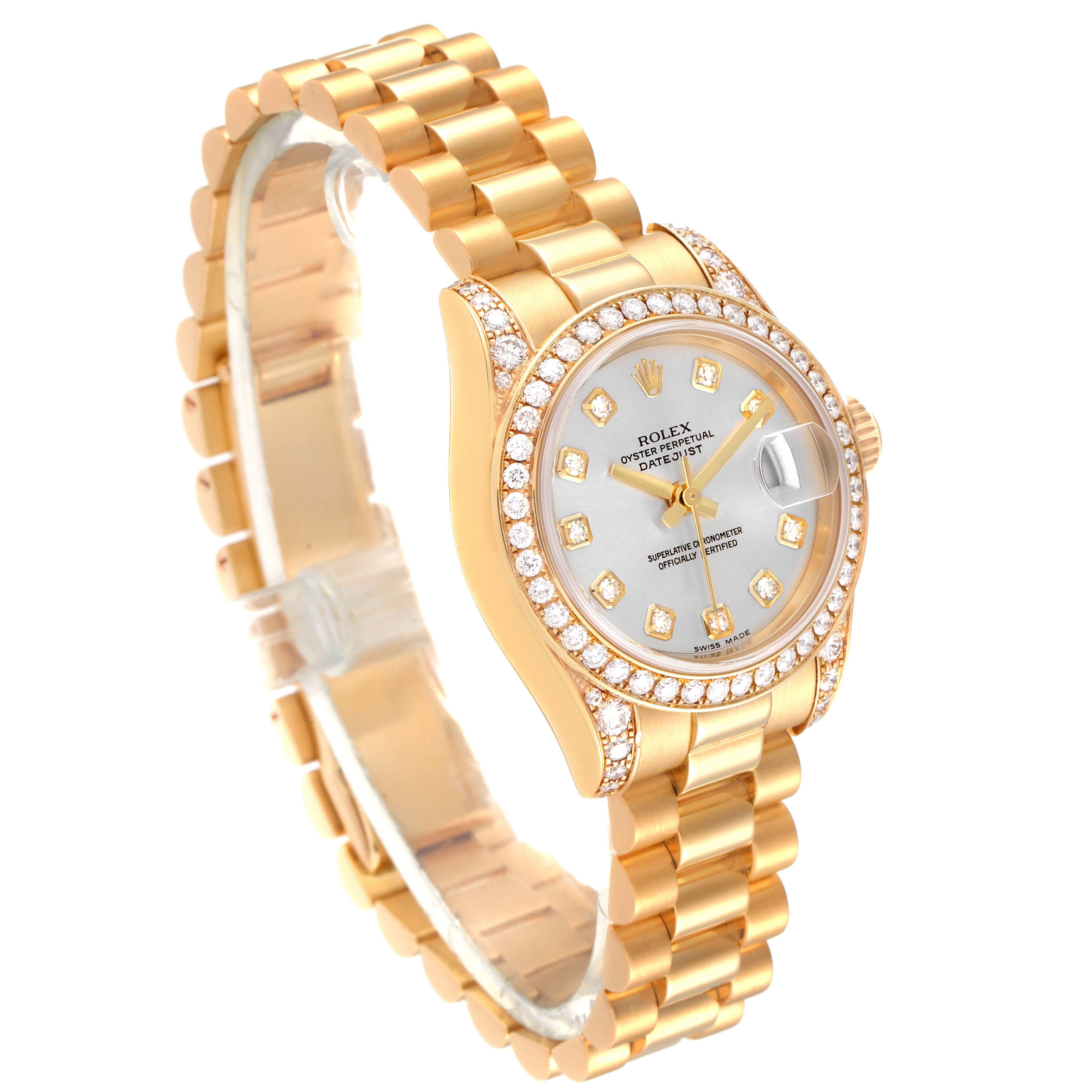 The Rolex President 179158 Women's Yellow Gold Silver Dial 179158 Women's Yellow Gold Silver Dial model watch is shown at a slight angle, highlighting its gold bracelet, diamond-studded bezel, and detailed dial.
