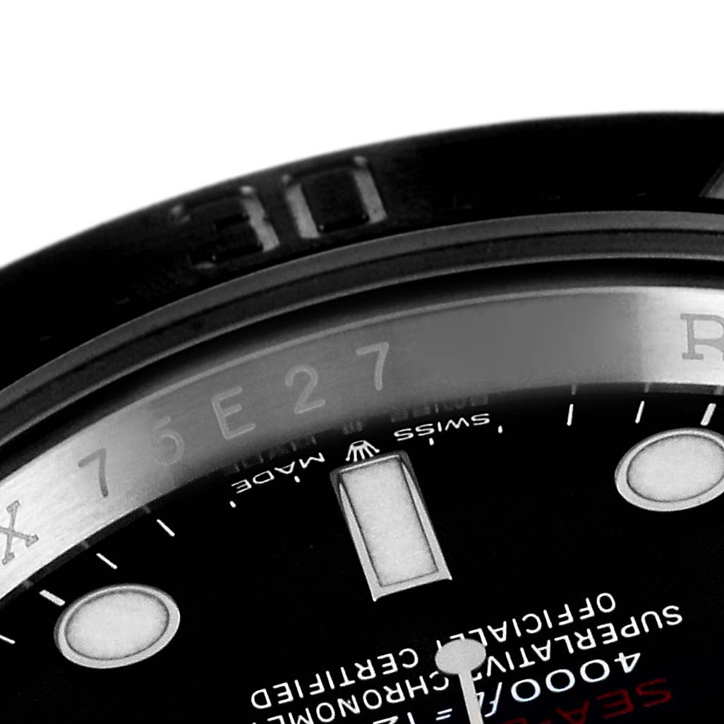 This image shows a close-up of the dial and part of the bezel of a Rolex Sea-Dweller 126600 Men's Stainless Steel Black Dial 126600 Men's Stainless Steel Black Dial watch.
